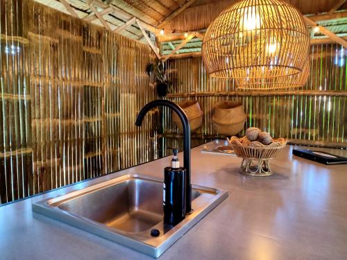 a kitchen with a sink and aaucet at 2BR 2Bath Eco Home Bungalow, Bangrak Beach, Koh Samui in Amphoe Koh Samui