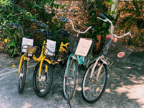 a group of three bikes parked next to each other at โรงแรมเพิ่มพูล 1 in Nan
