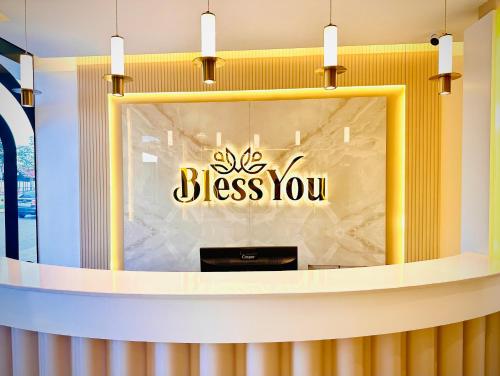 a store window with a sign that reads bless you at Bless You in Piraziz