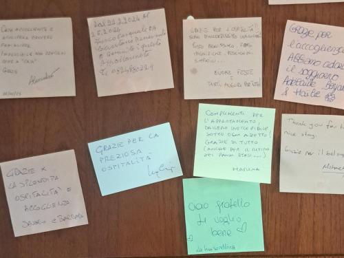 a bunch of papers on a table with handwriting on them at Casa Poldo in Cantello
