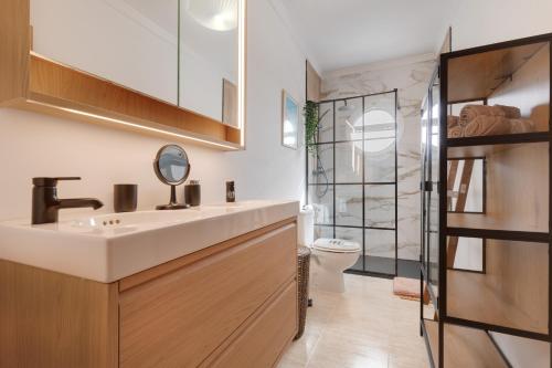 a bathroom with a sink and a toilet at Las Arenas Family in Costa Calma