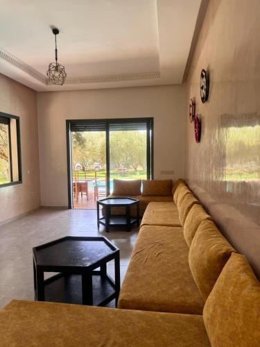 a living room with a couch and a table at green eden palace in Marrakech