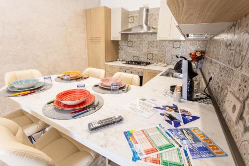 a kitchen with a table with plates on it at La casa di Metis in Agerola