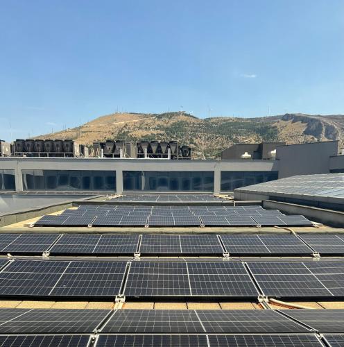 a group of solar panels on the roof of a building at Hotel Mepas in Mostar