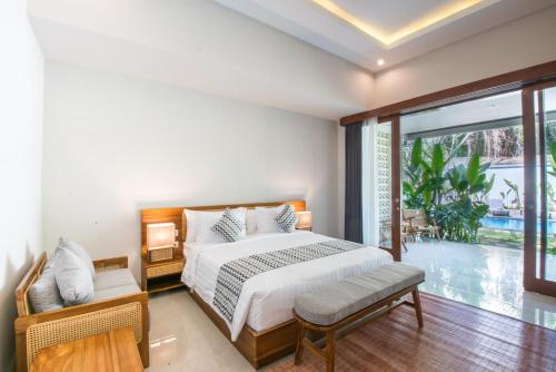Postel nebo postele na pokoji v ubytování Bhumi Sangtu Ubud