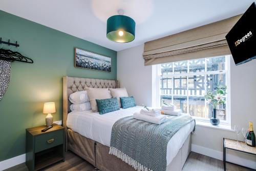a bedroom with a bed and a window at NEW! 4 x Stunning City Centre Apartments in Chester by 53 Degrees Property, Ideal for Individuals, Couples or Business Groups! in Chester