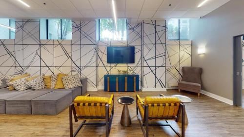 a living room with a couch and two chairs and a tv at Avenue B152 Perfect 2br! Pool Parking Gym in Philadelphia
