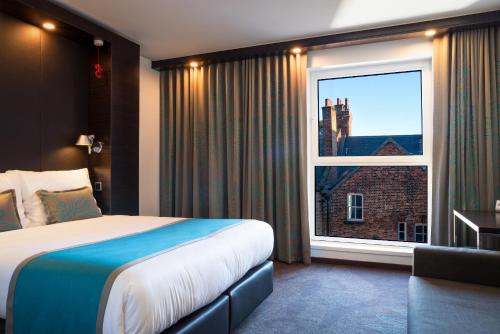 Postel nebo postele na pokoji v ubytování Motel One Newcastle