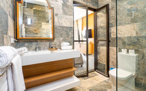 a bathroom with a sink and a toilet at The Lemonary Marrakech in Marrakech