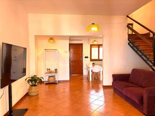 a living room with a couch and a table at Le dimore di Maria in Manfredonia