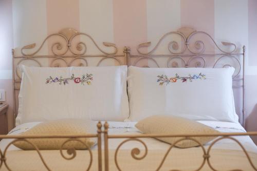 Ένα ή περισσότερα κρεβάτια σε δωμάτιο στο B&B Dolci Sogni