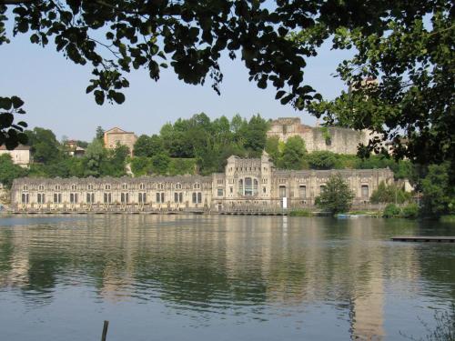 a view of a large building across a lake at Il Pozzo - 1711 Luxury Guest House in Arlate