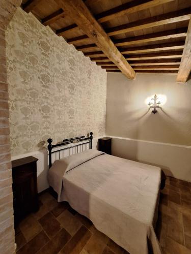 a bedroom with a large bed in a room at Terre di Cornossa in Marta