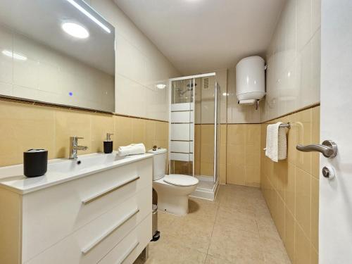 a bathroom with a sink and a toilet at Appartamento Oceano - Playa San Juan in Playa de San Juan