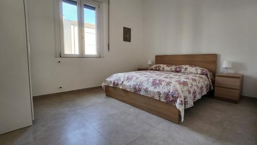 Postel nebo postele na pokoji v ubytování Aurora Rooms - Affitti Brevi Italia