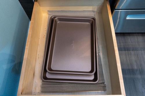 a cardboard box with a tablet in it at Self Check-in-washer-dryer-4ksmart Tv-king Bed-gym in Tacoma