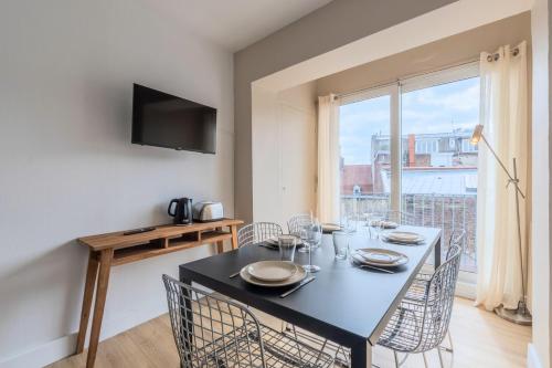 TV a/nebo společenská místnost v ubytování Renovated 3-bedroom flat on the Grand Place