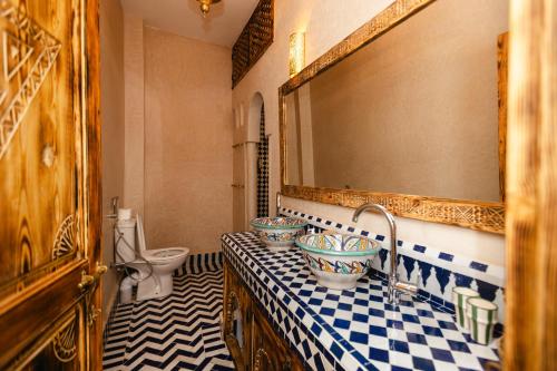 a bathroom with a sink and a toilet at Riad Anya & SPA in Marrakech