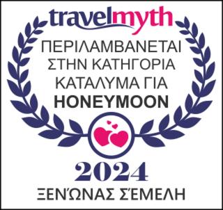 a sign with a laurel wreath and a medal at Semeli Guesthouse in Karpenision