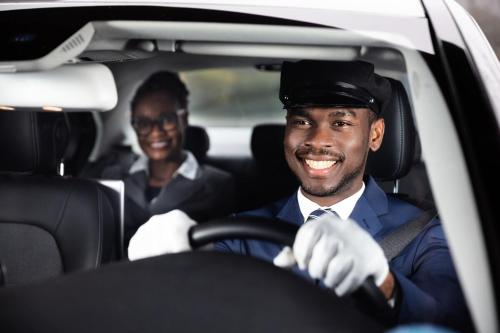 two men sitting in a car at Jhadano 3br Pool & Gym Shuttle Gated in Florence Hall