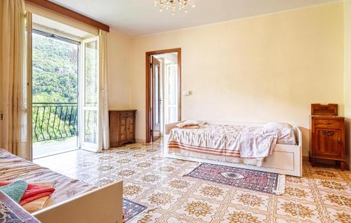 a bedroom with a bed and a large window at 3 Bedroom Pet Friendly Apartment In Ne in Ne