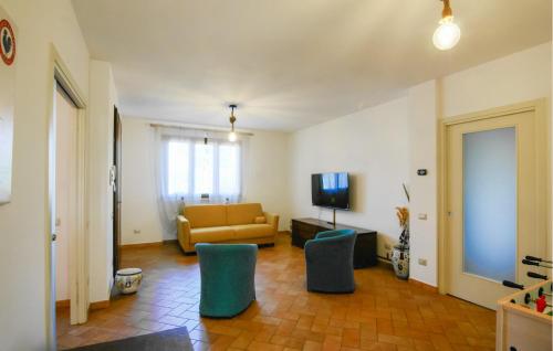 a living room with a couch and two chairs at Il Magnifico in Altopascio