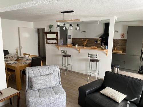 a living room with a couch and a table at Cool Montagne in Briançon