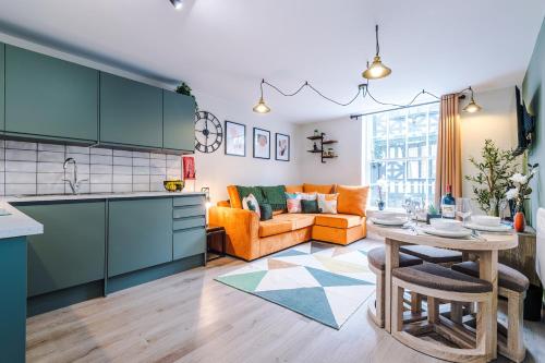 a kitchen and living room with a table and a couch at NEW! 4 x Stunning City Centre Apartments in Chester by 53 Degrees Property, Ideal for Individuals, Couples or Business Groups! in Chester