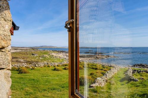 a window with a view of the ocean at Property 464 - Claddaghduff in Claddaghduff
