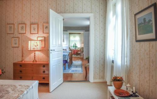 an open door to a room with a dining room at 4 Bedroom Stunning Home In Löderup in Löderup