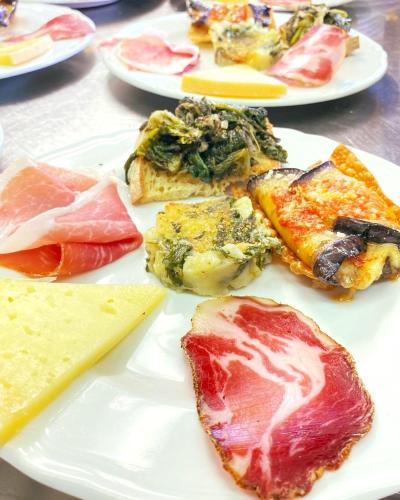 a white plate with different types of food on it at Masseria Fontana dei Fieri in Pietrelcina