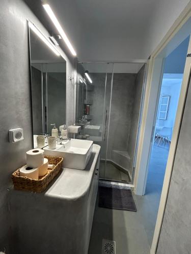 a bathroom with a sink and a shower at Thea Vouno Studios in Agia Pelagia Kythira