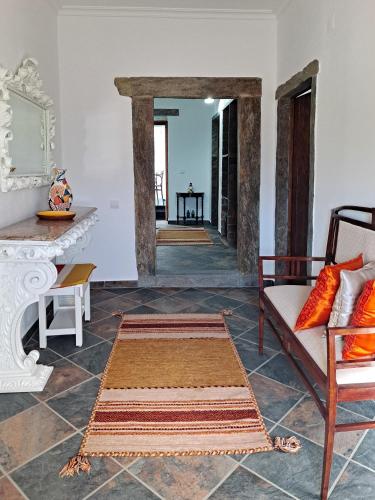 a living room with a couch and a table at Mourão Retreat in Mourão
