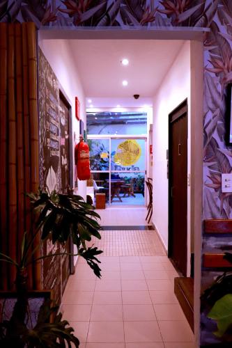 a hallway leading to a room with a table at Ruda Hostel in Buenos Aires