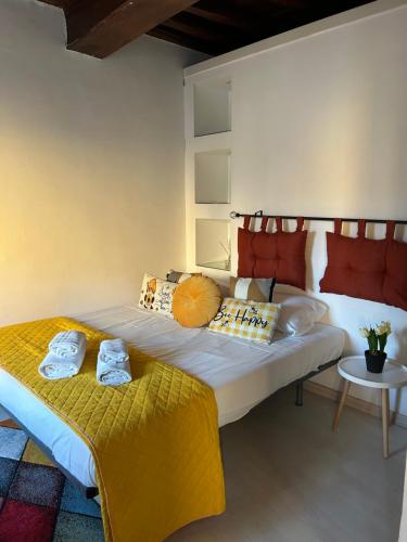 a bedroom with a large bed and a table at Navona Suite Rome - quite and view in Rome