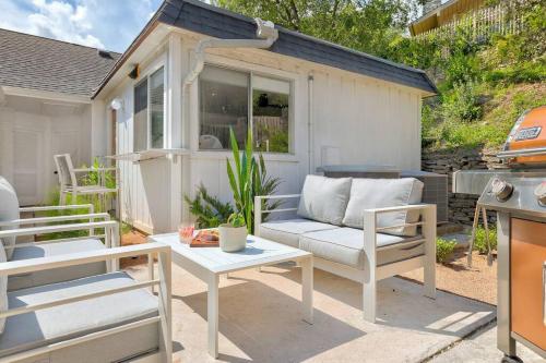 a patio with a couch and a table and chairs at Aviator's Suite in Lakeway