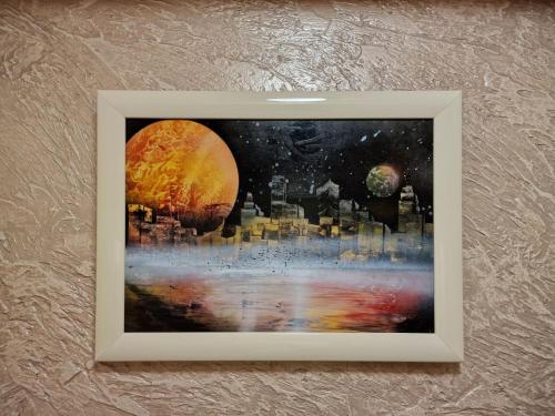 a framed picture of a painting of a city at Jermuk Villa Imperial in Jermuk