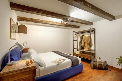 a bedroom with a bed and a mirror at The Right Place 4U Monserrato Apartment in Rome