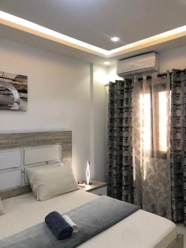 Ένα ή περισσότερα κρεβάτια σε δωμάτιο στο APPARTEMENT MEUBLE DAKAR Suite 1