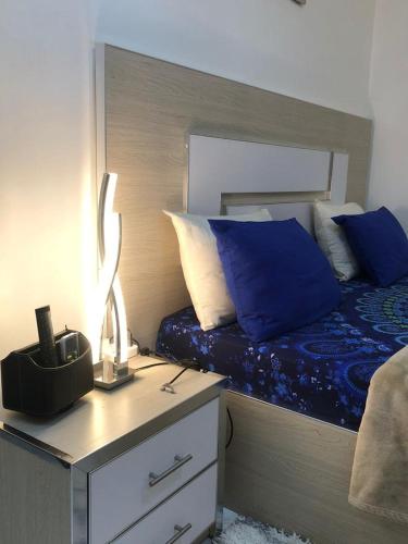 Ένα ή περισσότερα κρεβάτια σε δωμάτιο στο APPARTEMENT MEUBLE DAKAR Suite 1