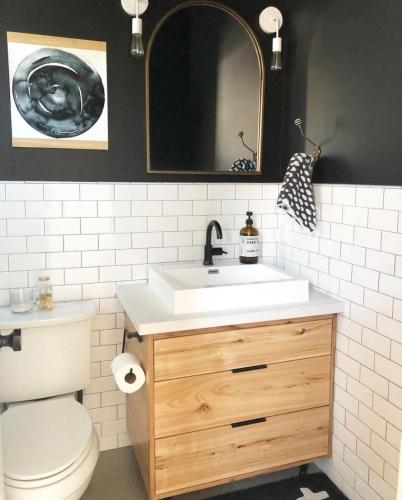 a bathroom with a sink and a toilet and a mirror at Black Barn Ranch 25 Acres Wpool Near Downtown in San Luis Obispo