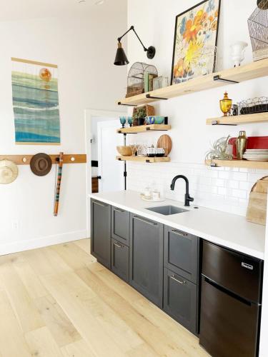 a kitchen with gray cabinets and a sink at Black Barn Ranch 25 Acres Wpool Near Downtown in San Luis Obispo
