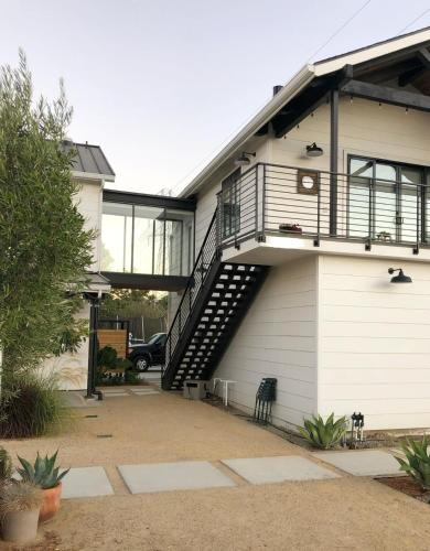 a house with a staircase on the side of it at Black Barn Ranch 25 Acres Wpool Near Downtown in San Luis Obispo