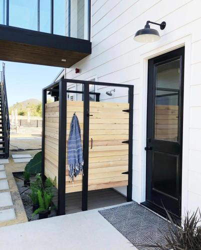 a front door of a house with a wooden wall at Black Barn Ranch 25 Acres Wpool Near Downtown in San Luis Obispo