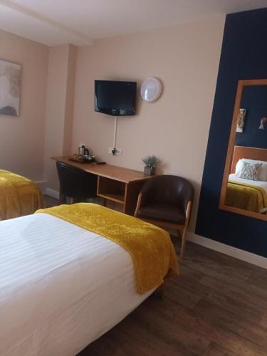 Un ou plusieurs lits dans un hébergement de l'établissement The Renishaw Rooms