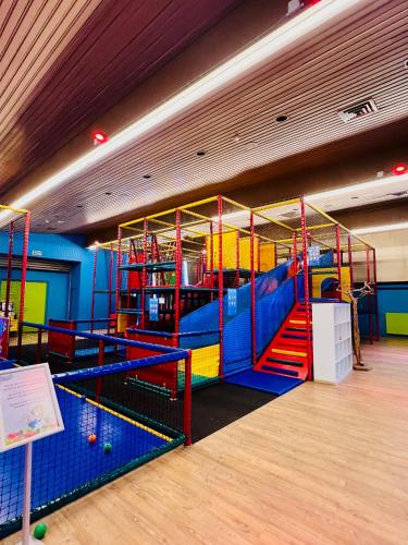 a brightly colored play room with a slide at Vakantiehuis Yesmi in Bruinisse