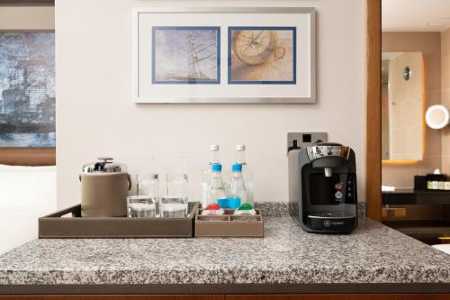a kitchen counter with a coffee maker and a toaster at InterContinental London - The O2 in London