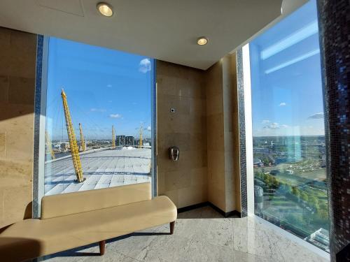 a living room with a view of a building at InterContinental London - The O2 in London