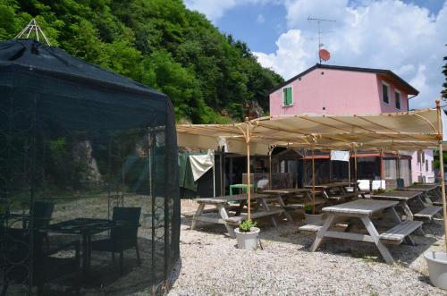 a group of picnic tables under a tent at Agriturismo Corte Marani in Badia Calavena