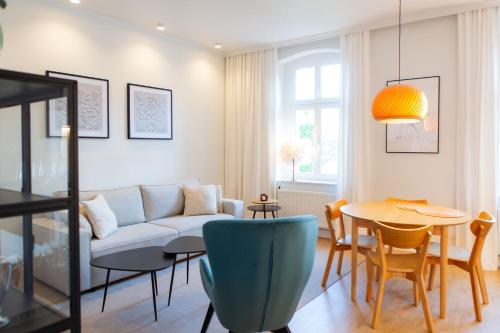a living room with a couch and a table at Carola7 in Szczawno-Zdrój